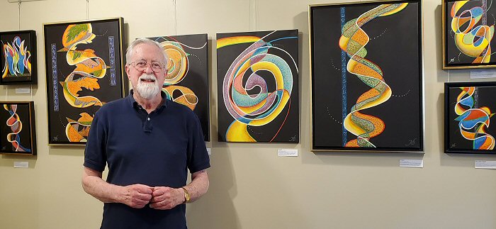 the artist with an
                                            exhibition of his work